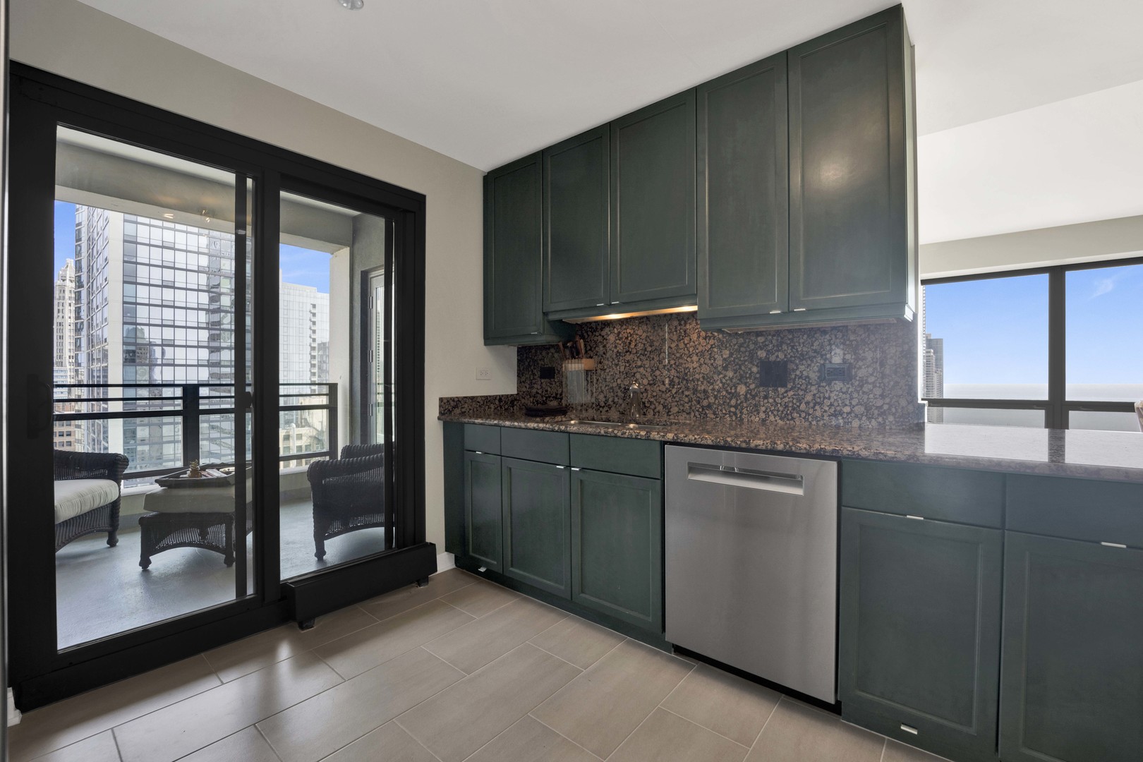 130 North Garland Court, Unit 3001 Chicago, IL 60602 - Photo 19 of 63 a kitchen with stainless steel appliances granite countertop a refrigerator and a sink