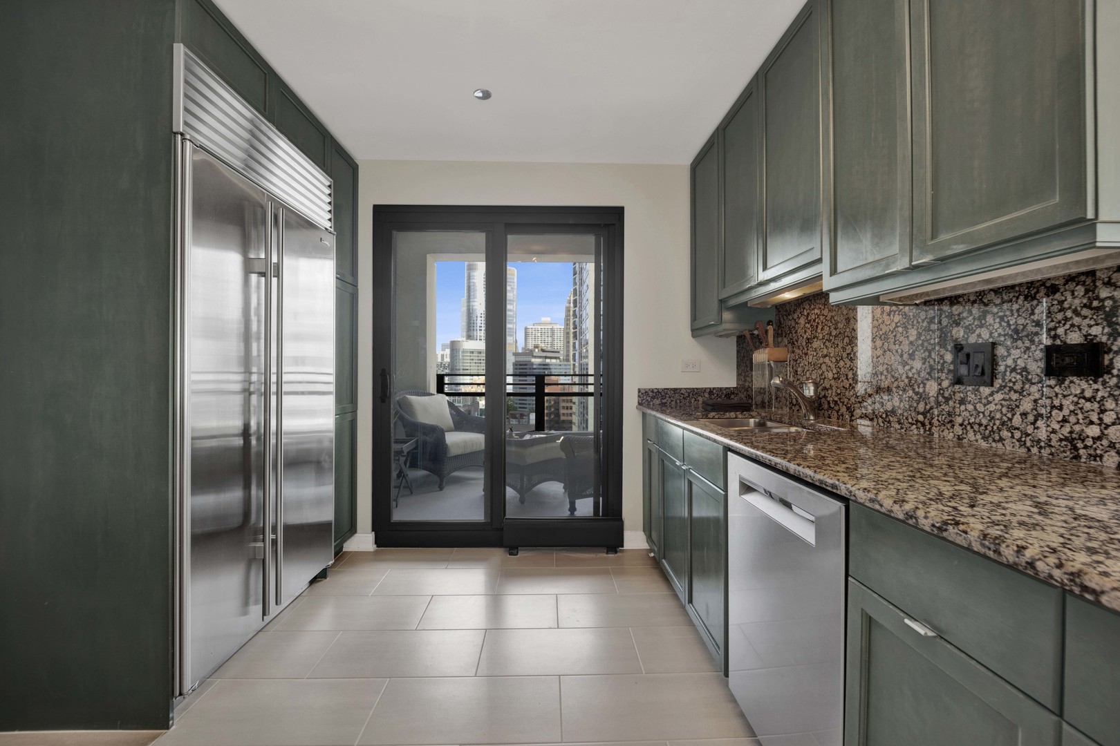 130 North Garland Court, Unit 3001 Chicago, IL 60602 - Photo 20 of 63 a kitchen with stainless steel appliances granite countertop a refrigerator and a sink