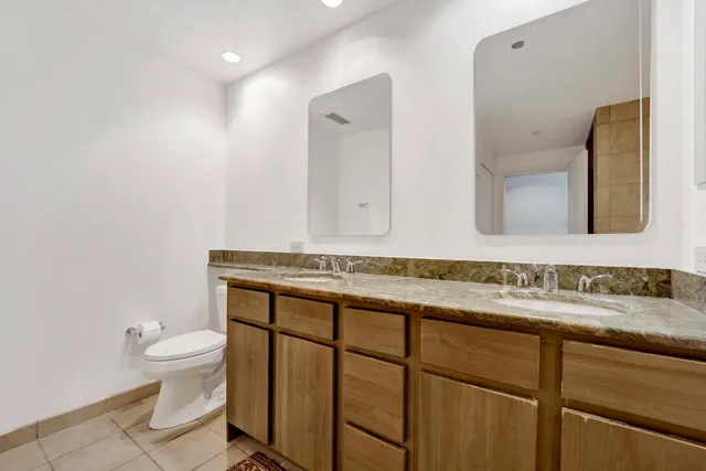 a view of building with outdoor seating and a potted plant