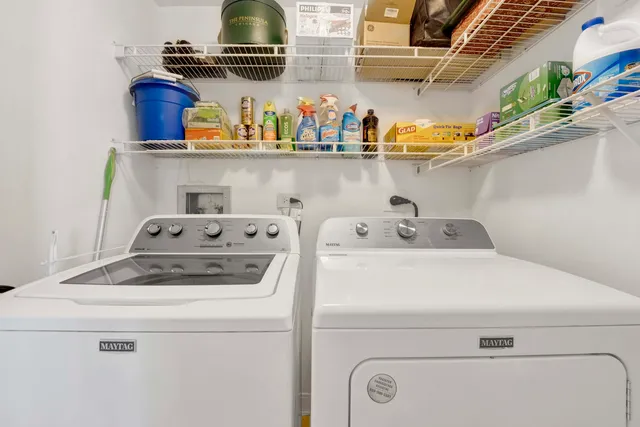 a view of a chairs and table in a patio