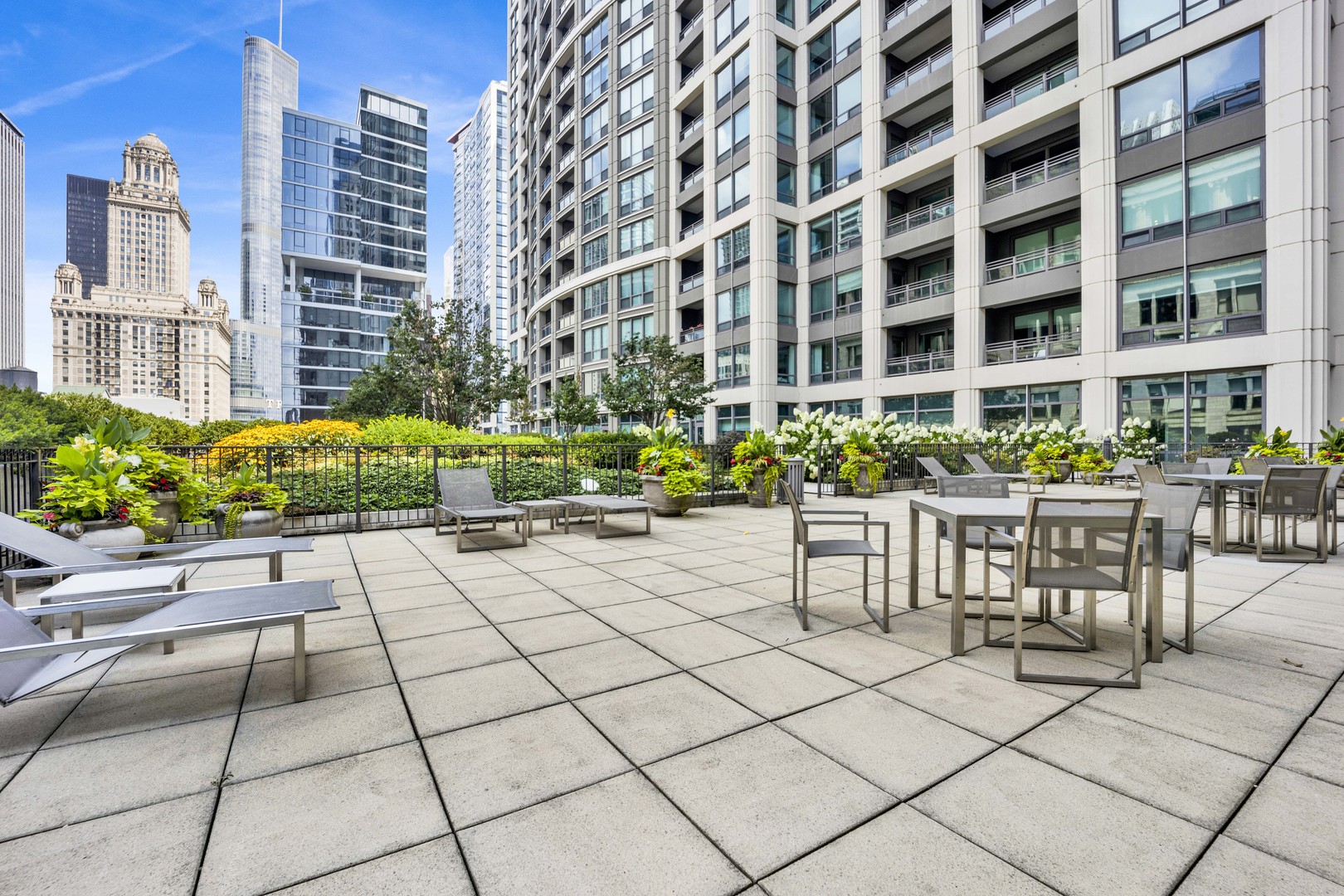 130 North Garland Court, Unit 3001 Chicago, IL 60602 - Photo 49 of 63 a view of building with outdoor seating and a potted plant
