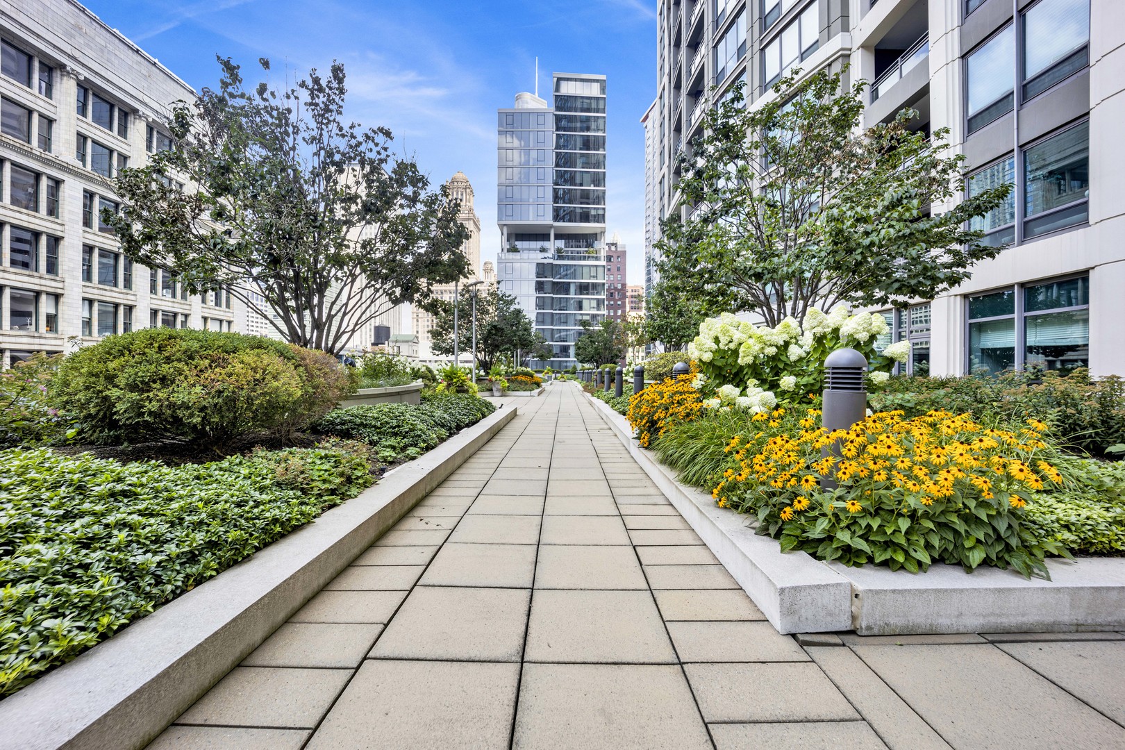 130 North Garland Court, Unit 3001 Chicago, IL 60602 - Photo 50 of 63 a view of a pathway that has potted plants
