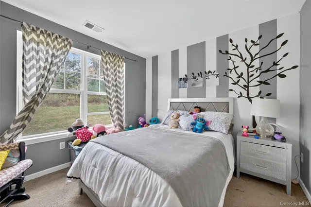 a bathroom with a sink a toilet and shower curtain