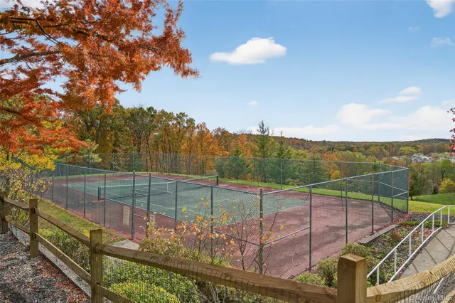 a room with furniture and large windows