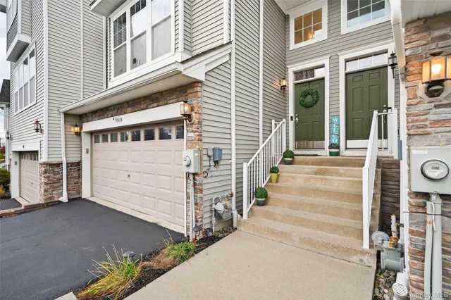 a view of a house with a window and stairs