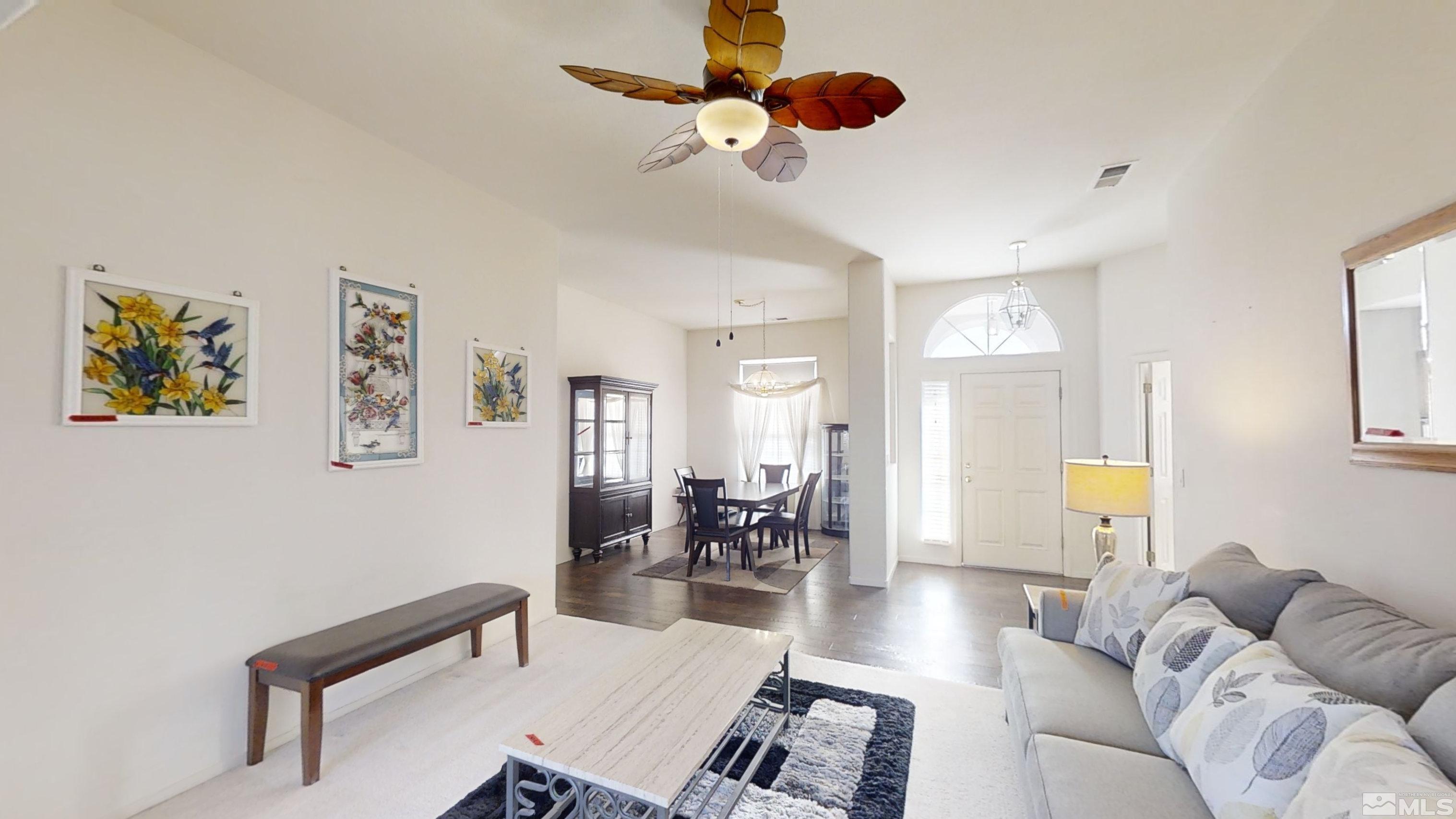 10421 Silver Rush Court Reno, NV 89521 - Photo 9 of 30 a living room with furniture and a wooden floor