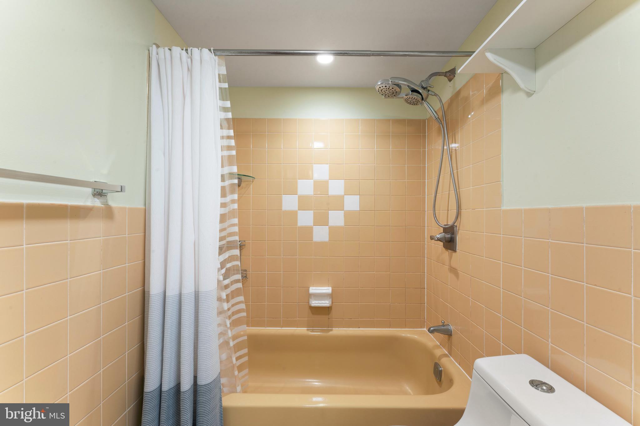 8940 Krewstown Road, Unit 204 Philadelphia, PA 19115 - Photo 20 of 23 a bathroom with a bathtub and a shower