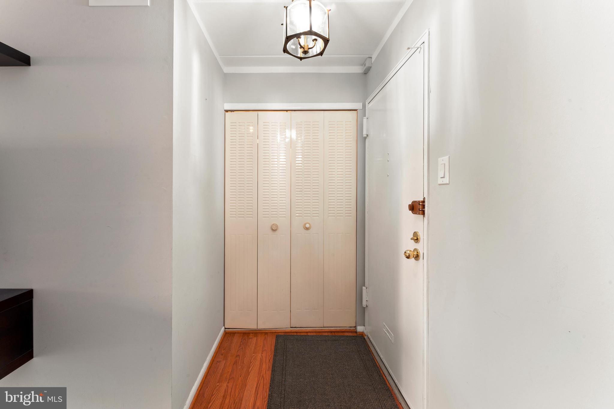 8940 Krewstown Road, Unit 204 Philadelphia, PA 19115 - Photo 4 of 23 a view of a hallway with wooden floor
