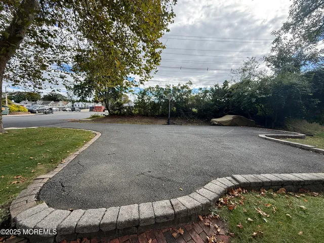 a view of a house with a yard and garage