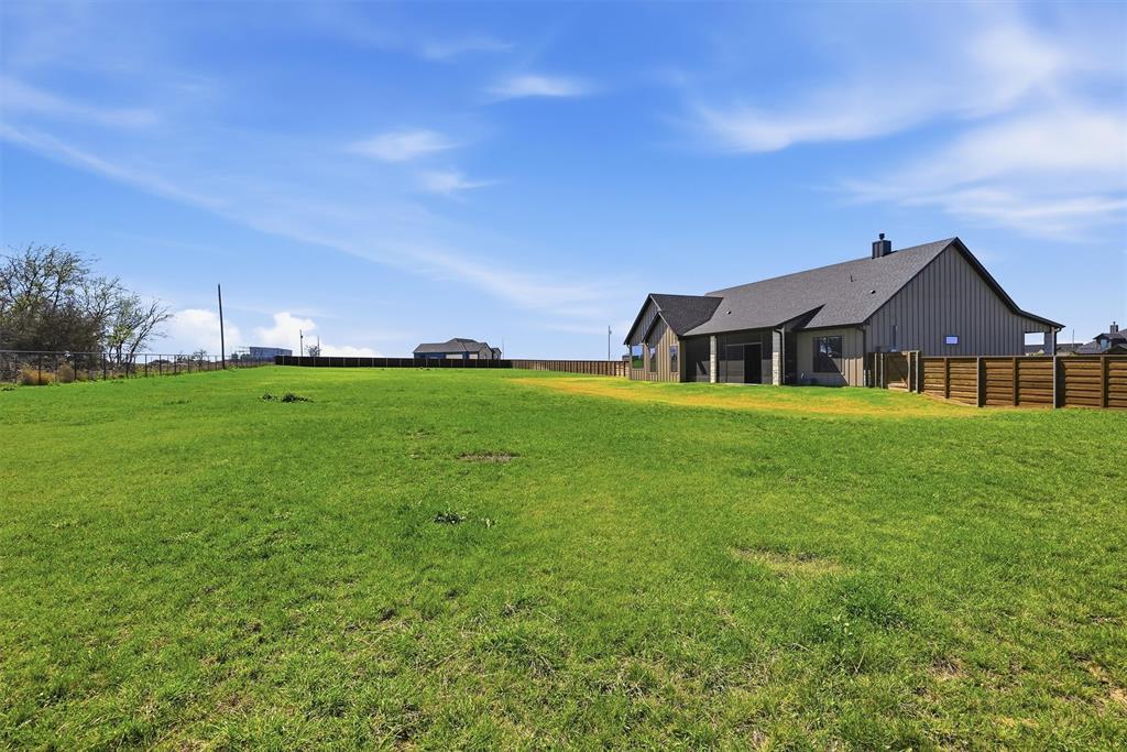 6620 Buffalo Ridge Circle Godley, TX 76044 - Photo 35 of 40 a view of a house with a big yard