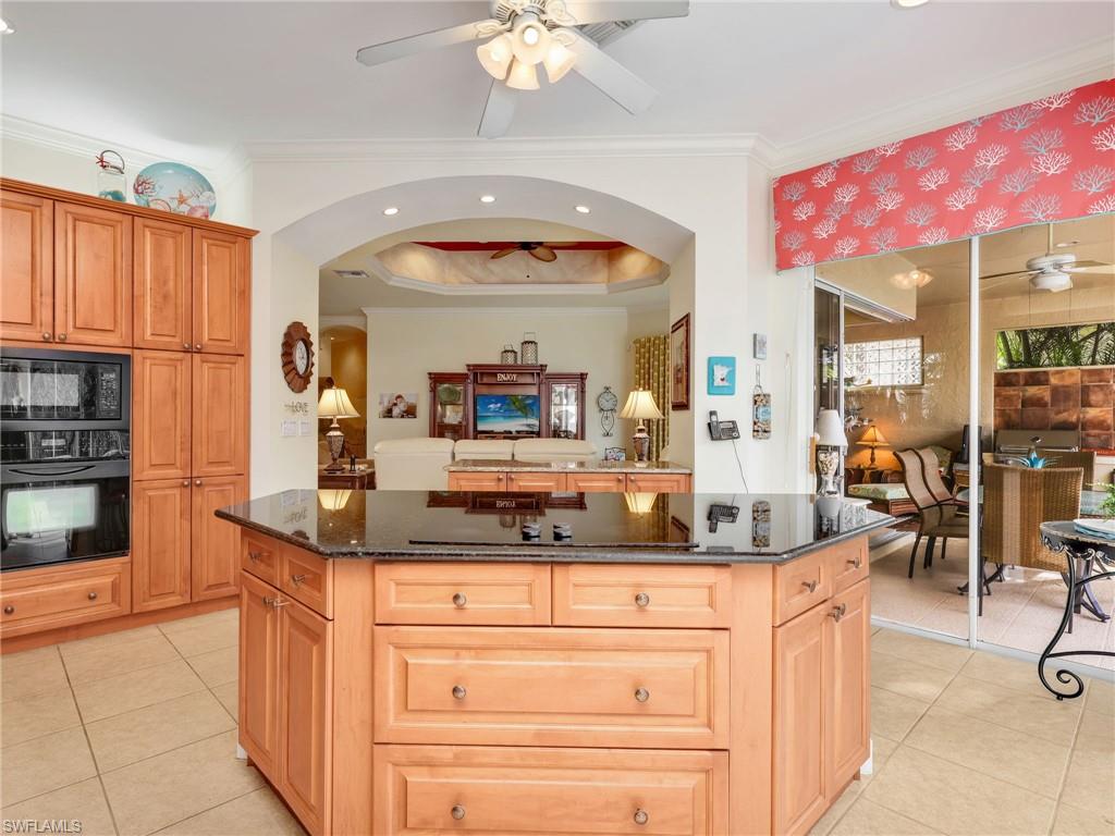 353 Steerforth Court Naples, FL 34110 - Photo 17 of 40 a kitchen with cabinets a sink and appliances