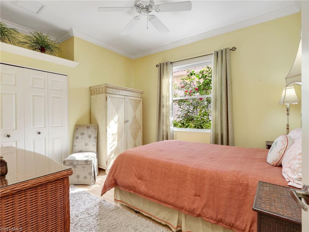 353 Steerforth Court Naples, FL 34110 - Photo 23 of 40 a bedroom with a bed and a window