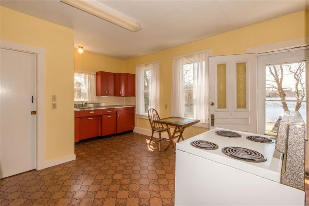 49 Adams Pond Road Boothbay, ME 04537 - Photo 5 of 25 The kitchen, with metal cabinets...