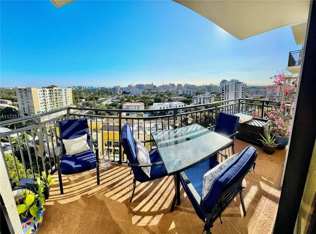 a view of a balcony with furniture