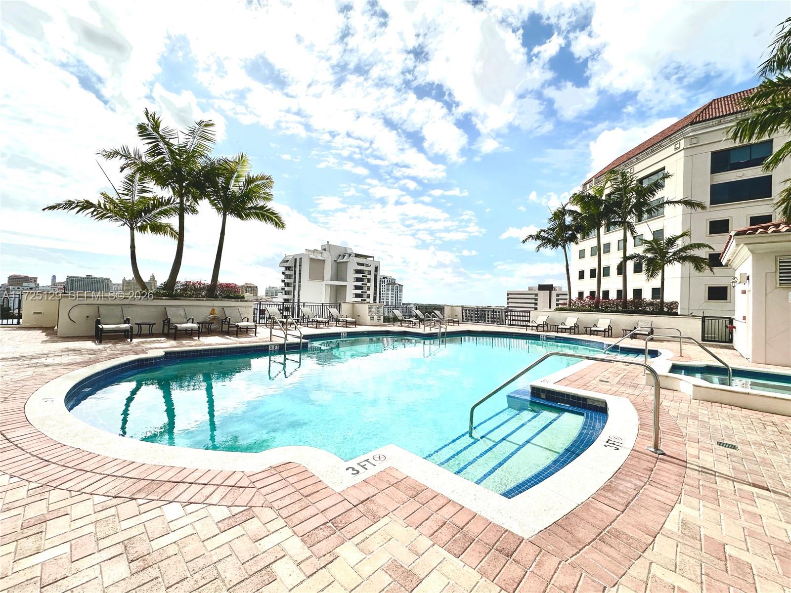 888 Douglas Road, Unit 1210 Coral Gables, FL 33134 - Photo 23 of 29 a view of a swimming pool with a lake view