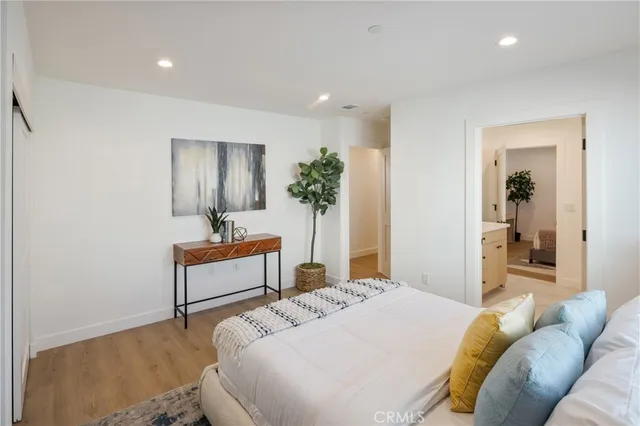 a bedroom with a bed and a dresser