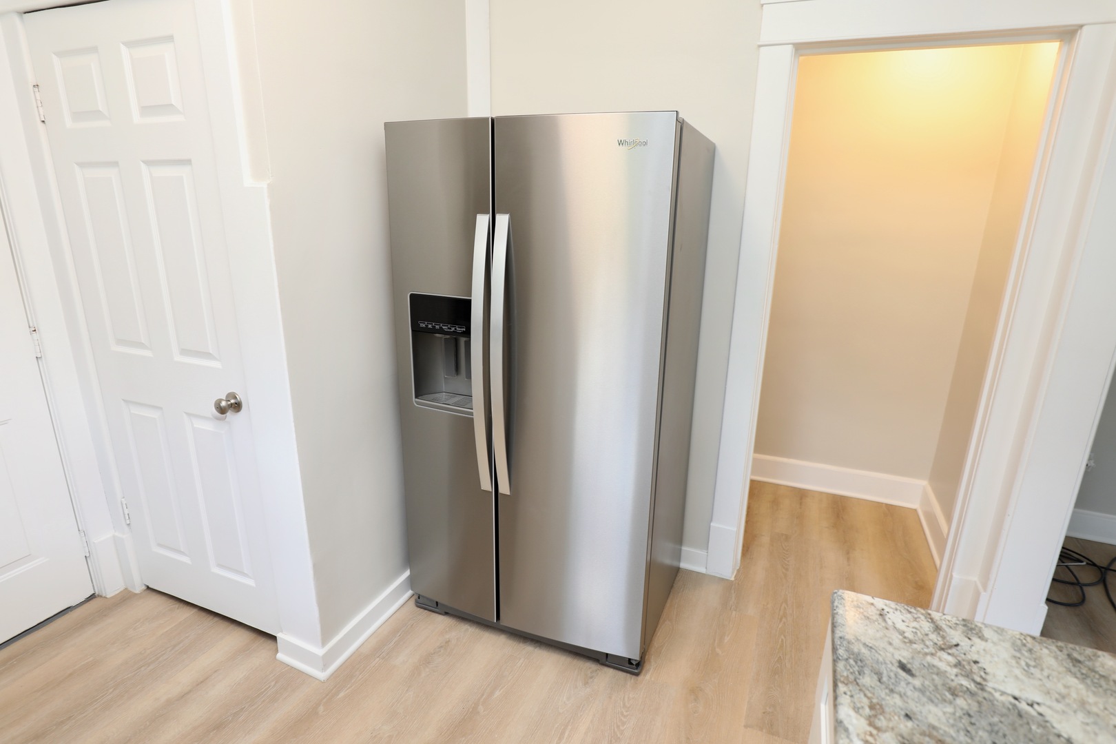 507 Grant Avenue Joliet, IL 60433 - Photo 5 of 16 a view of a kitchen with wooden floor and refrigerator