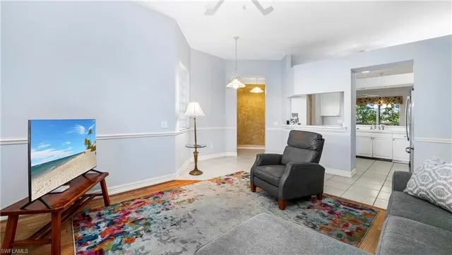 a living room with furniture and a rug