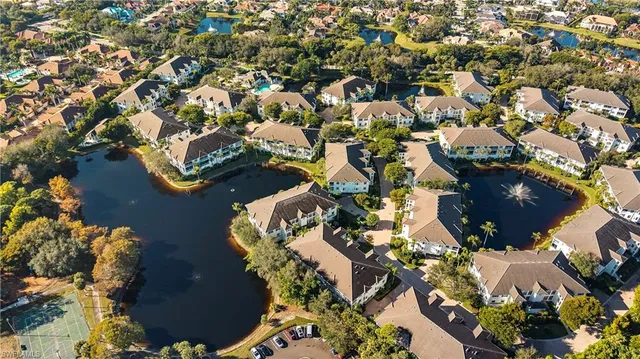 an aerial view of a houses with yard