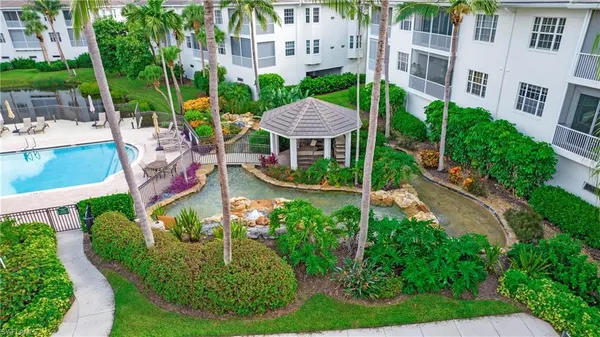 an aerial view of a house with a garden and plants