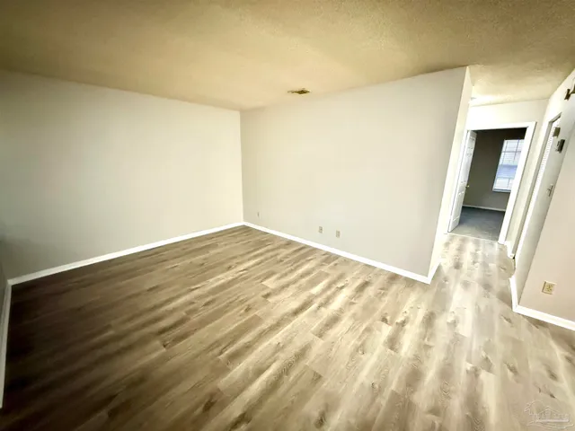 a view of a big room with wooden floor