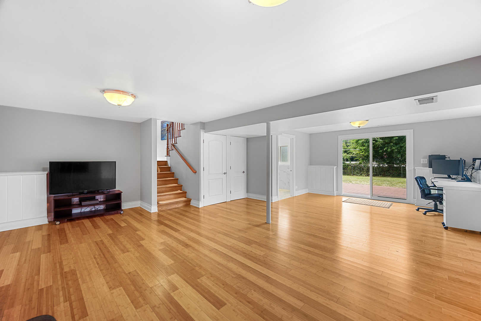 1S550 Nimitz Road Oakbrook Terrace, IL 60181 - Photo 11 of 23 a view of an empty room with wooden floor and a window