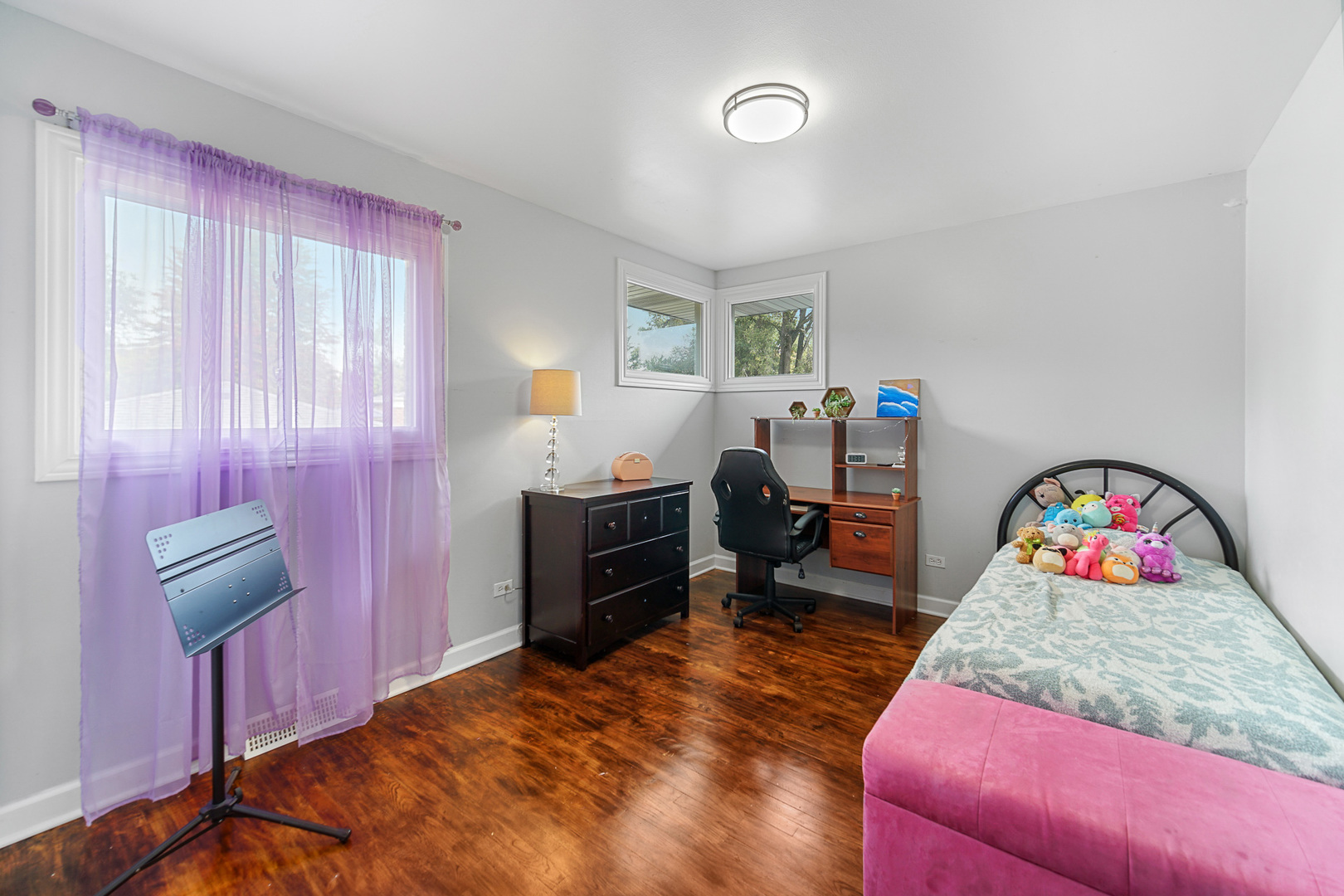 1S550 Nimitz Road Oakbrook Terrace, IL 60181 - Photo 13 of 23 a bedroom with a bed and a dresser in it