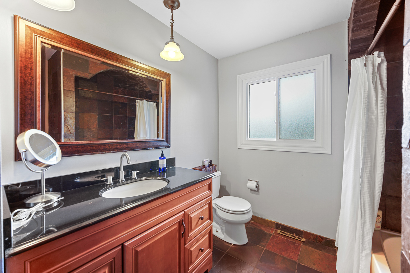 1S550 Nimitz Road Oakbrook Terrace, IL 60181 - Photo 15 of 23 a bathroom with a granite countertop sink toilet and mirror