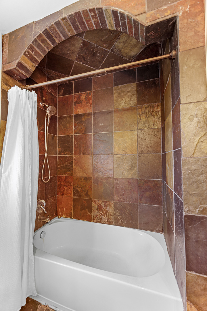 1S550 Nimitz Road Oakbrook Terrace, IL 60181 - Photo 16 of 23 a bathroom with a bathtub and a shower