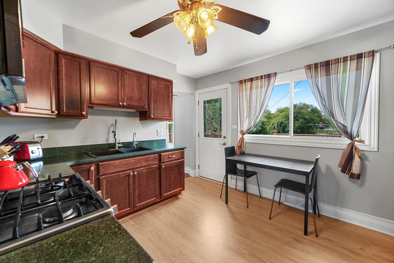 1S550 Nimitz Road Oakbrook Terrace, IL 60181 - Photo 17 of 23 a kitchen with sink a window and appliances