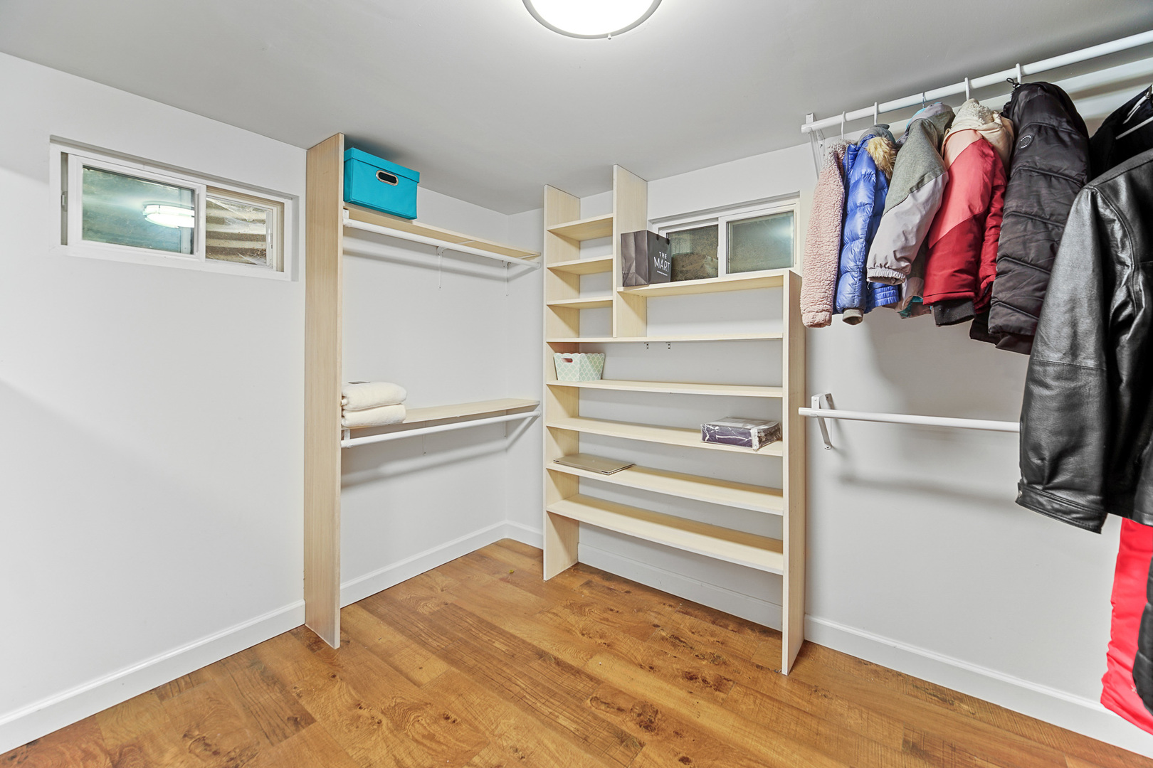 1S550 Nimitz Road Oakbrook Terrace, IL 60181 - Photo 21 of 23 a view of walk in closet with clothes and shoes