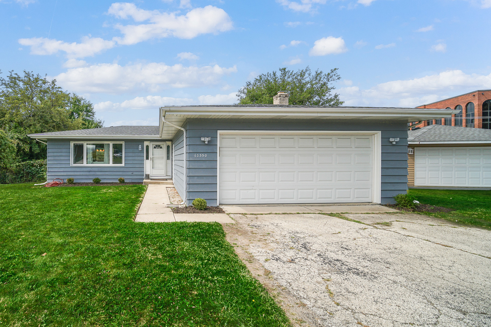 1S550 Nimitz Road Oakbrook Terrace, IL 60181 - Photo 23 of 23 a front view of a house with a yard and garage