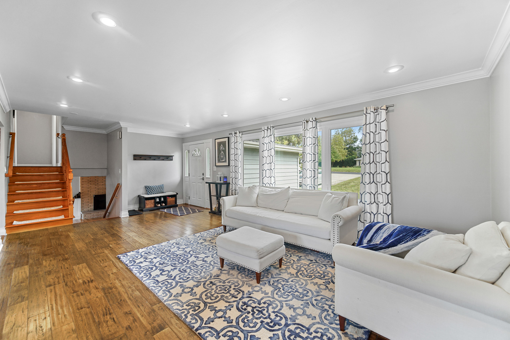 1S550 Nimitz Road Oakbrook Terrace, IL 60181 - Photo 5 of 23 a living room with furniture and wooden floor