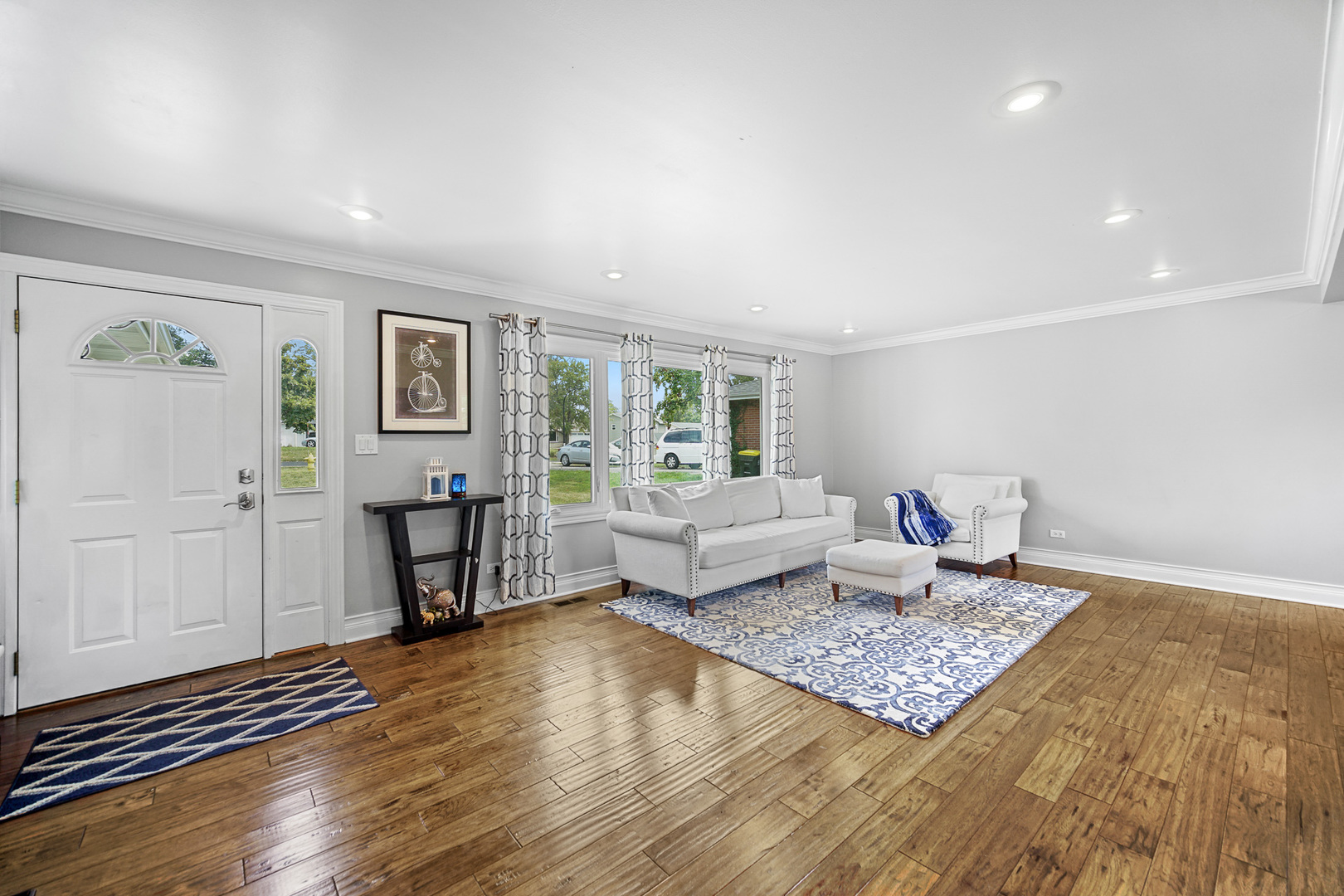 1S550 Nimitz Road Oakbrook Terrace, IL 60181 - Photo 6 of 23 a living room with furniture and a rug