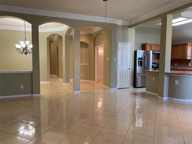 a view of a hallway with wooden shelves