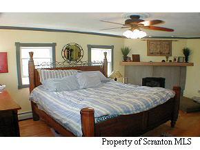 6 Indian Spring Road Tunkhannock, PA 18657 - Photo 4 of 7 a bedroom with a bed and window