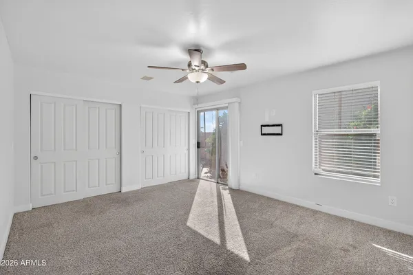 a view of an empty room with a window
