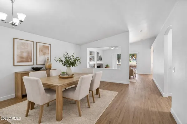 a view of a dining room with furniture and wooden floor