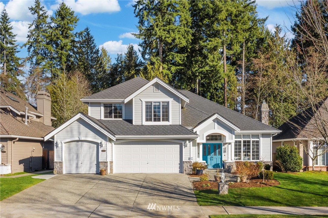 21409 31st Avenue Southeast Bothell, WA 98021 - Photo 1 of 40 a front view of a house with a yard