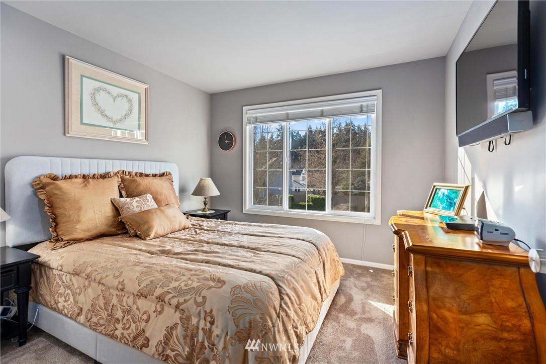 21409 31st Avenue Southeast Bothell, WA 98021 - Photo 21 of 40 a bedroom with bed and a window