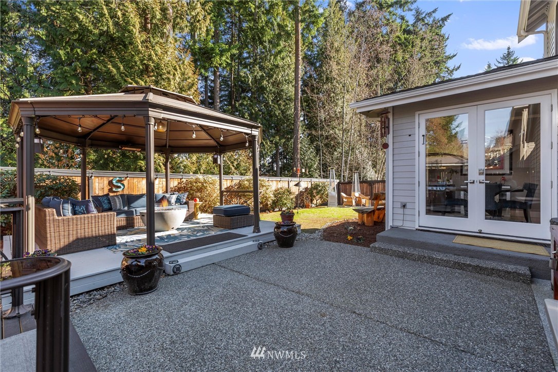 21409 31st Avenue Southeast Bothell, WA 98021 - Photo 29 of 40 a view of a patio with a table and chairs under an umbrella