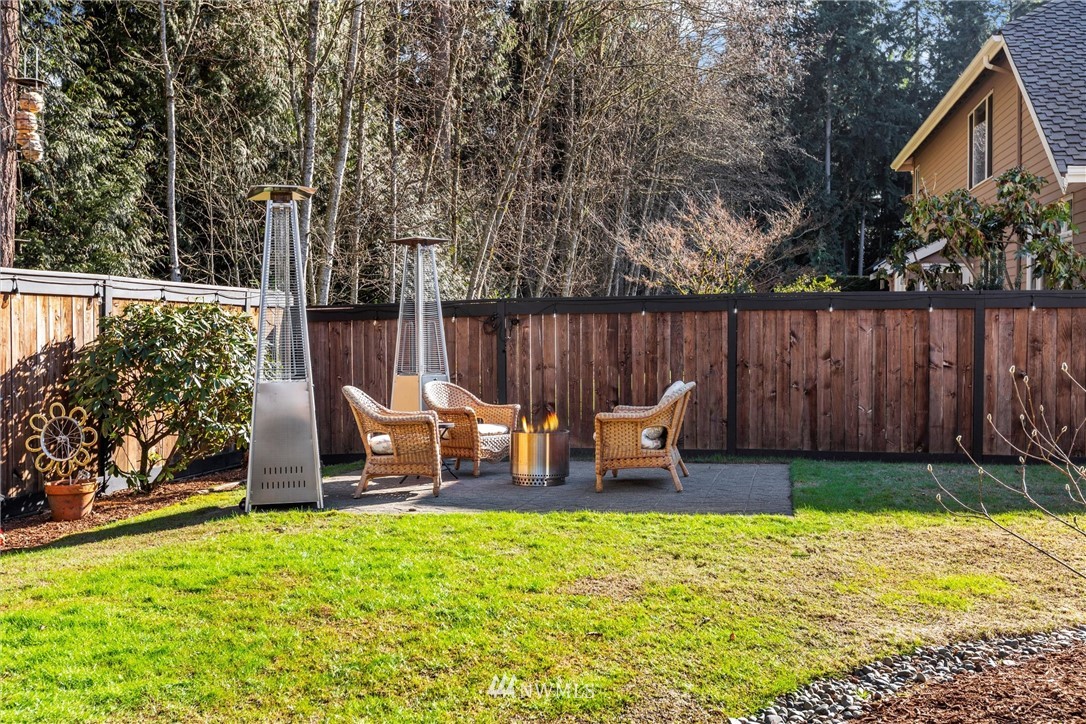 21409 31st Avenue Southeast Bothell, WA 98021 - Photo 32 of 40 a view of a chair and table in the backyard