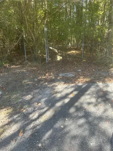 a view of residential houses with yard and mountain view