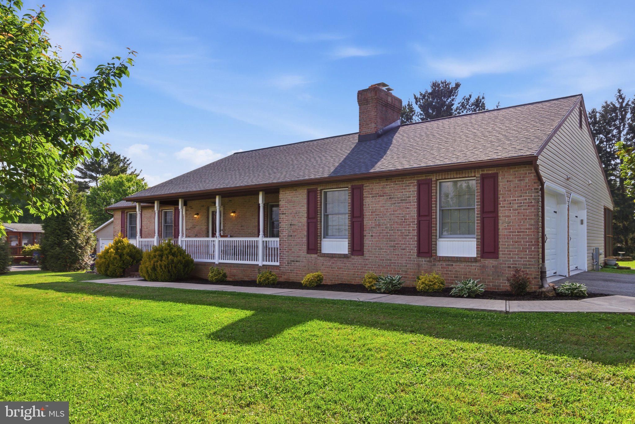 18310 Upper Beckleysville Road Hampstead, MD 21074 - Photo 5 of 67 Charming brick home with lush greenery.