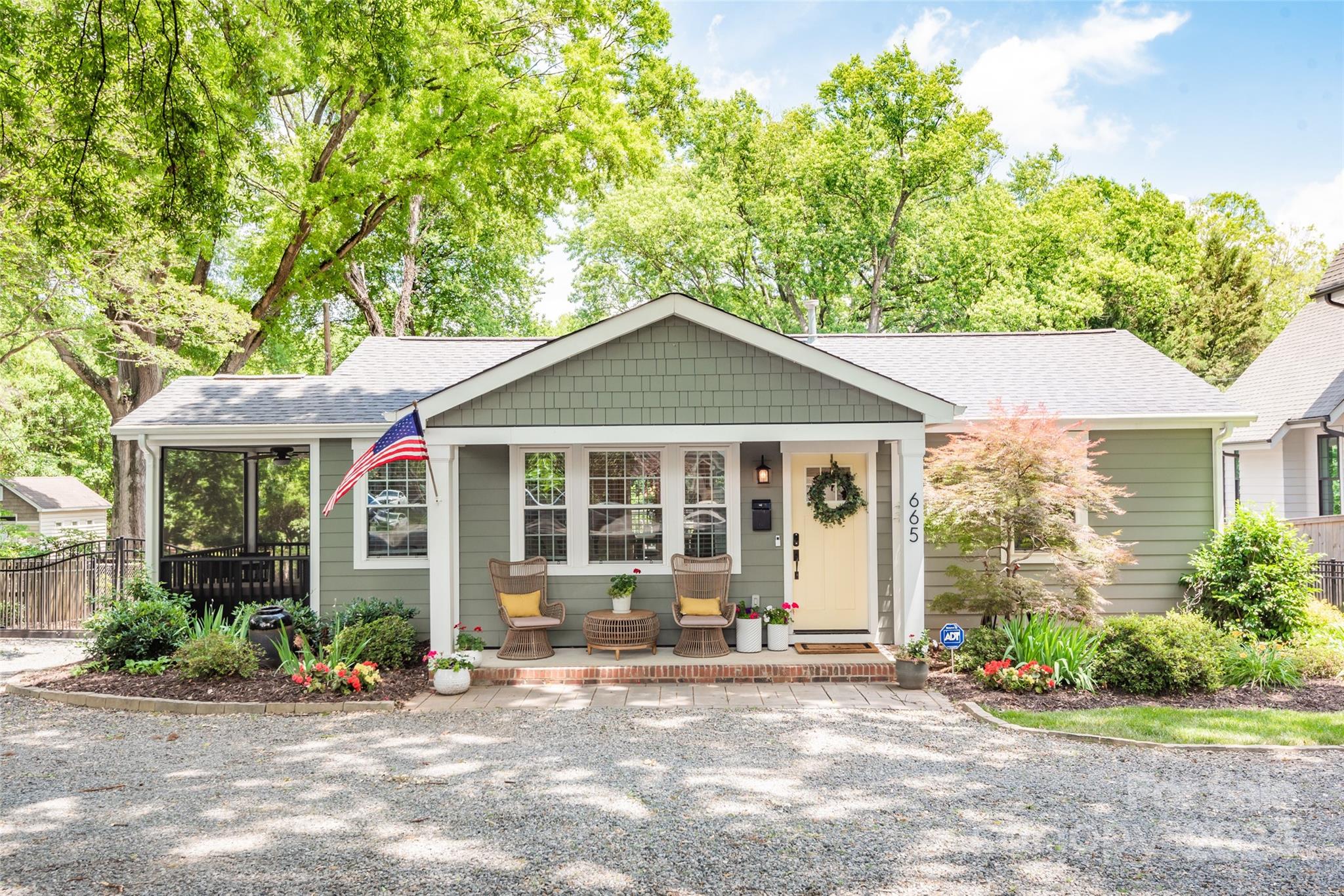 665 Marsh Road Charlotte, NC 28209 - Photo 1 of 31 a front view of a house with garden