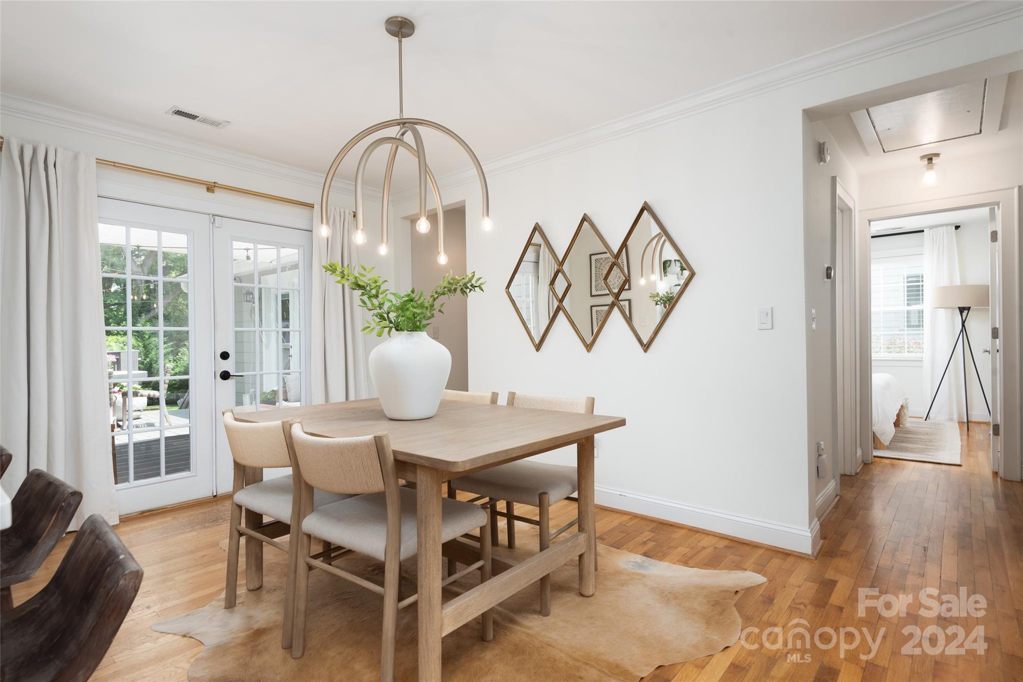 665 Marsh Road Charlotte, NC 28209 - Photo 13 of 31 a view of a dining room with furniture and wooden floor