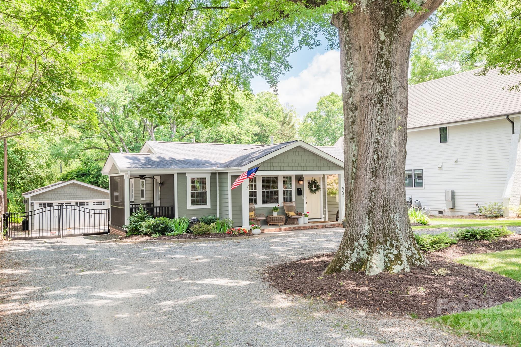 665 Marsh Road Charlotte, NC 28209 - Photo 2 of 31 a front view of a house with garden