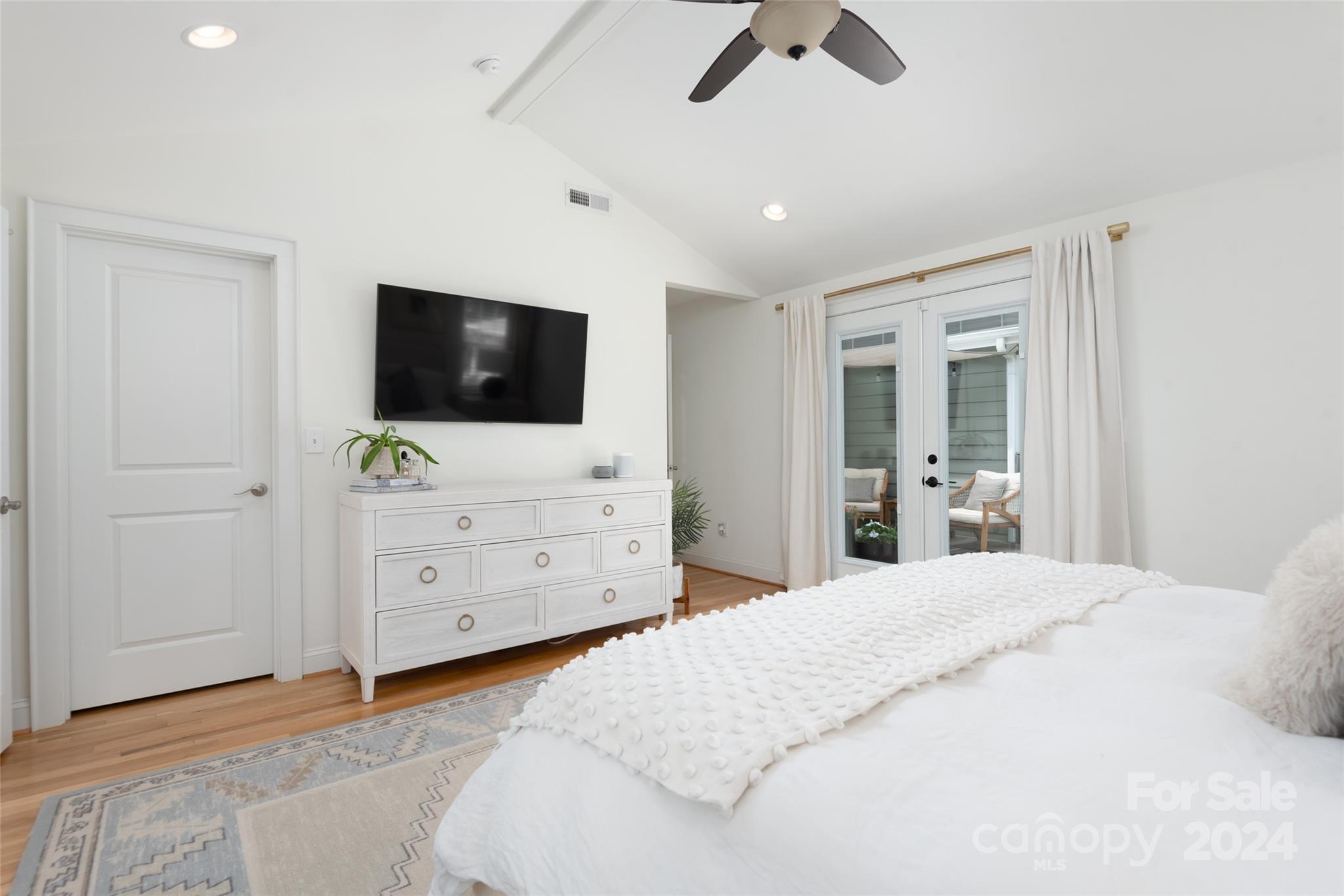 665 Marsh Road Charlotte, NC 28209 - Photo 21 of 31 a bedroom with a bed and a flat screen tv