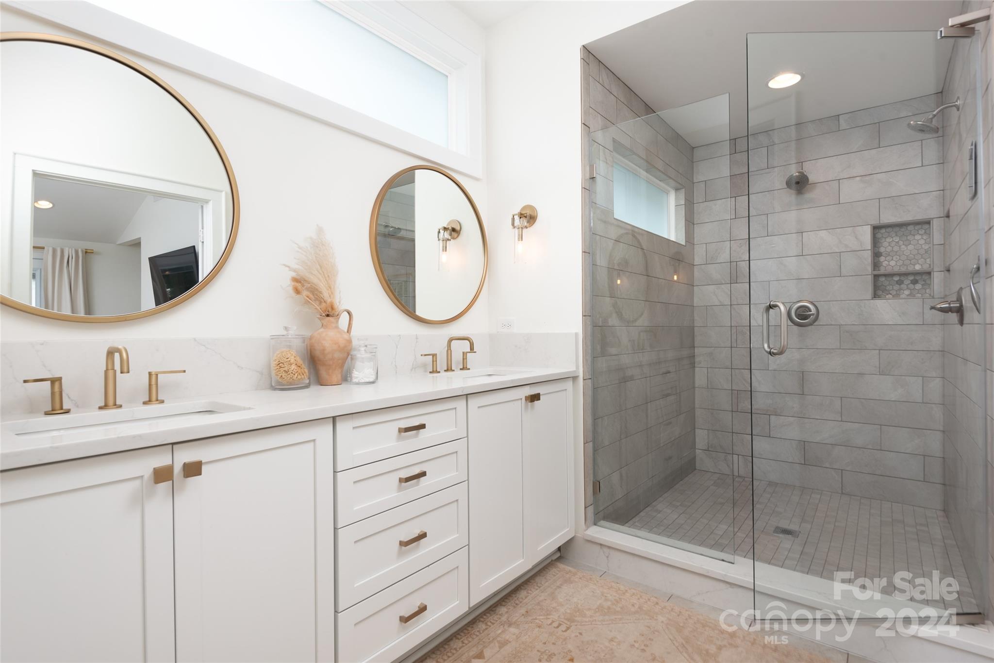 665 Marsh Road Charlotte, NC 28209 - Photo 22 of 31 a bathroom with a double vanity sink mirror and shower