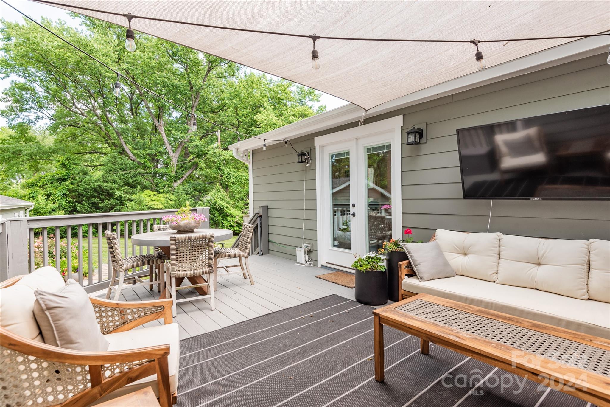 665 Marsh Road Charlotte, NC 28209 - Photo 3 of 31 a view of a patio with couches table and chairs and potted plants